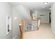Hallway with a view of staircase and natural light at 106 Roundtop Rd, Cary, NC 27519