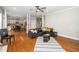 Open-concept living space with hardwood floors, seamlessly connecting the kitchen and living areas at 106 Roundtop Rd, Cary, NC 27519