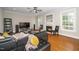 Spacious living room with a fireplace, hardwood floors, lots of natural light, and stylish furnishings at 106 Roundtop Rd, Cary, NC 27519