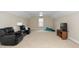 Large living room with a ceiling fan and comfortable seating at 106 Roundtop Rd, Cary, NC 27519