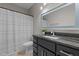 Modern bathroom with granite countertops, updated vanity and shower with bathtub combo at 107 Covington Dr, Chapel Hill, NC 27514