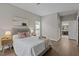 Bedroom with wood floors, neutral colored walls, a queen bed, and an ensuite bathroom at 107 Covington Dr, Chapel Hill, NC 27514