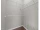 Walk-in closet with gray walls and metal shelving units for organization at 107 Covington Dr, Chapel Hill, NC 27514