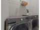 Well-equipped laundry room featuring LG washer, dryer, and convenient shelving at 107 Covington Dr, Chapel Hill, NC 27514