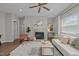 Inviting living room with fireplace, light gray walls, and hardwood flooring at 107 Covington Dr, Chapel Hill, NC 27514