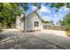 Rear exterior view of a home featuring large driveway and private garage at 107 Covington Dr, Chapel Hill, NC 27514