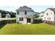 Backyard view features a large lawn, fenced yard, and patio at 109 Citrine Ct, Durham, NC 27703