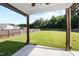 Exterior of the backyard features a large lawn with a patio at 109 Citrine Ct, Durham, NC 27703