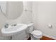 Clean and simple half bathroom featuring modern fixtures and a pedestal sink at 109 Citrine Ct, Durham, NC 27703