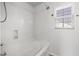 Bathroom features a bathtub and shower combination with tiled walls and a window at 109 Citrine Ct, Durham, NC 27703