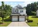 Charming two-story home with a well-manicured lawn, a two-car garage, and lovely landscaping at 109 Citrine Ct, Durham, NC 27703