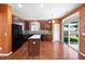 Well-lit kitchen with stainless steel appliances, island, and a sliding door at 109 Citrine Ct, Durham, NC 27703