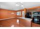 Efficient kitchen with island, stainless steel appliances, and warm orange walls at 109 Citrine Ct, Durham, NC 27703