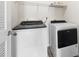 Well-lit laundry room features washer and dryer at 109 Citrine Ct, Durham, NC 27703