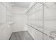 Organized walk-in closet with white wire shelving and neutral carpet at 109 Citrine Ct, Durham, NC 27703