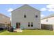 Exterior view of home features a patio, grill, and spacious fenced backyard at 110 Bray Dr, Mebane, NC 27302