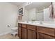 Well-lit bathroom with double sink vanity, framed mirror, and a shower tub with a curtain at 110 Bray Dr, Mebane, NC 27302