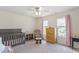 Cozy bedroom with a crib, rocking chair, and soft pink accents at 110 Bray Dr, Mebane, NC 27302