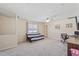 Bonus room featuring a futon, office area, and neutral carpet at 110 Bray Dr, Mebane, NC 27302