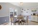 Inviting breakfast area adjacent to the kitchen, with a sliding glass door at 110 Bray Dr, Mebane, NC 27302