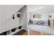 Entryway featuring a coat rack with hooks and a built-in bench that leads into a play area and living room at 110 Bray Dr, Mebane, NC 27302