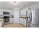 Well-equipped kitchen with stainless steel appliances, granite counters, and ample white cabinetry at 110 Bray Dr, Mebane, NC 27302