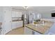 Kitchen island features granite countertops and stainless steel sink, perfect for cooking and entertaining at 110 Bray Dr, Mebane, NC 27302