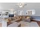 Cozy living room showcases an open floor plan with dark floors and a comfortable sectional sofa at 110 Bray Dr, Mebane, NC 27302
