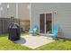 Private patio with grill and blue Adirondack chairs, ideal for outdoor dining and relaxing at 110 Bray Dr, Mebane, NC 27302