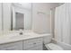 Clean bathroom features a single vanity and tub with shower behind a curtain at 11005 Louson Pl, Raleigh, NC 27614