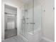 Bathroom features tiled floors, glass shower and walk in closet at 11005 Louson Pl, Raleigh, NC 27614
