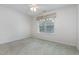 Cozy bedroom with a ceiling fan and large window with colorful valance for ample natural light at 11005 Louson Pl, Raleigh, NC 27614