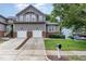 Charming two-story home featuring a two-car garage, mature landscaping, and a well-maintained lawn at 11005 Louson Pl, Raleigh, NC 27614