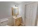 Bathroom with tile floors, vanity with granite countertop, and a door at 111 Dee Long Rd, Roxboro, NC 27574