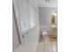 Well lit bathroom features tile floor, window and vanity with granite countertop at 111 Dee Long Rd, Roxboro, NC 27574