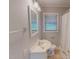 Full bathroom with a new vanity, toilet and tiled floors, and shower at 111 Dee Long Rd, Roxboro, NC 27574