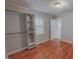 Cozy bedroom featuring wood floors, closet, window with natural light and neutral walls at 111 Dee Long Rd, Roxboro, NC 27574