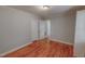 Neutral bedroom featuring wood floors, doors, closet and baseboards at 111 Dee Long Rd, Roxboro, NC 27574
