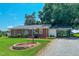Charming brick home with a metal roof, carport, and well-manicured lawn at 111 Dee Long Rd, Roxboro, NC 27574