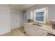 Traditional kitchen with white cabinetry, tiled countertops, and stainless steel sink at 111 Dee Long Rd, Roxboro, NC 27574