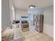 Functional kitchen with stainless steel appliances, ample counter space, and tiled flooring at 111 Dee Long Rd, Roxboro, NC 27574