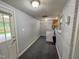 Bright laundry room offers painted brick, built in storage and access to the exterior at 111 Dee Long Rd, Roxboro, NC 27574