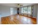Bright living room features gorgeous hardwood floors, lots of natural light, and easy access to other rooms at 111 Dee Long Rd, Roxboro, NC 27574