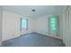 A clean bedroom with two windows invites relaxation at 1116 Little Creek Rd, Durham, NC 27713