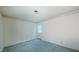 This bright bedroom features neutral walls, blue carpet, and a decorative floral border at 1116 Little Creek Rd, Durham, NC 27713