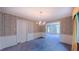 Dining room with a chandelier, classic wallpaper, and ample natural light at 1116 Little Creek Rd, Durham, NC 27713