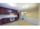 Cozy kitchen with ample cabinet space, standard appliances, and vintage flooring at 1116 Little Creek Rd, Durham, NC 27713