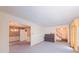 Spacious living room with hardwood floors, piano, and view of dining room and staircase at 1116 Little Creek Rd, Durham, NC 27713
