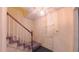 A carpeted staircase with wood railing, leading to the upper level of this beautifully maintained home at 1116 Little Creek Rd, Durham, NC 27713