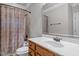 Bathroom with a vanity, mirror, shower with curtain, and toilet at 1124 Kalworth Rd, Wake Forest, NC 27587